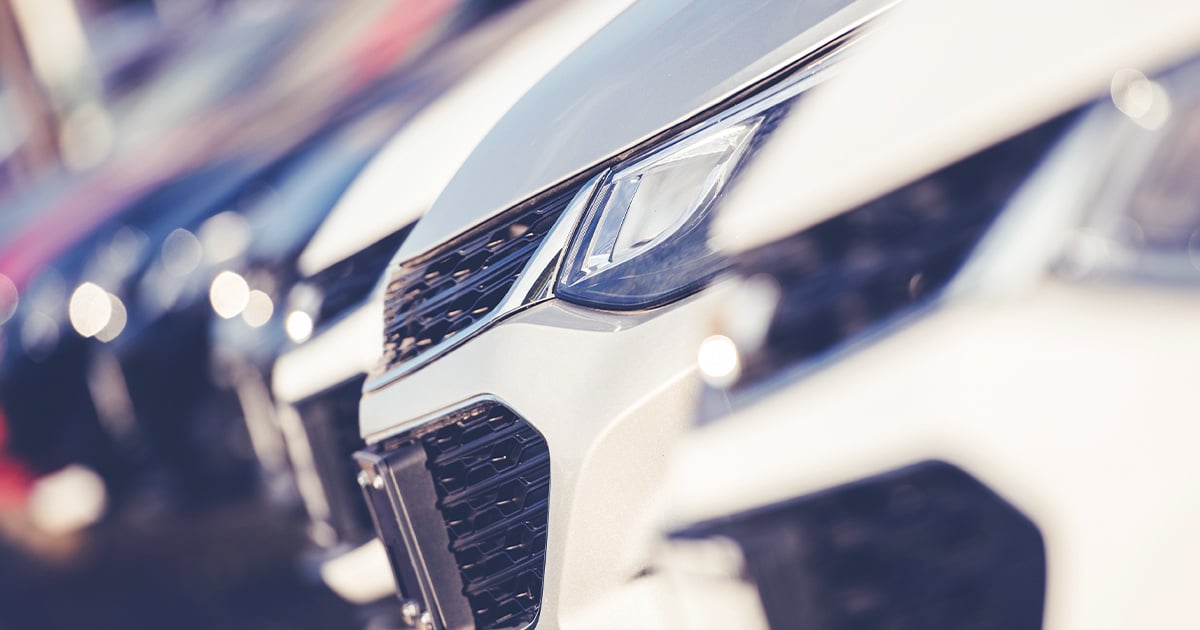 Car Dealership Stock With Line Of New Vehicles.